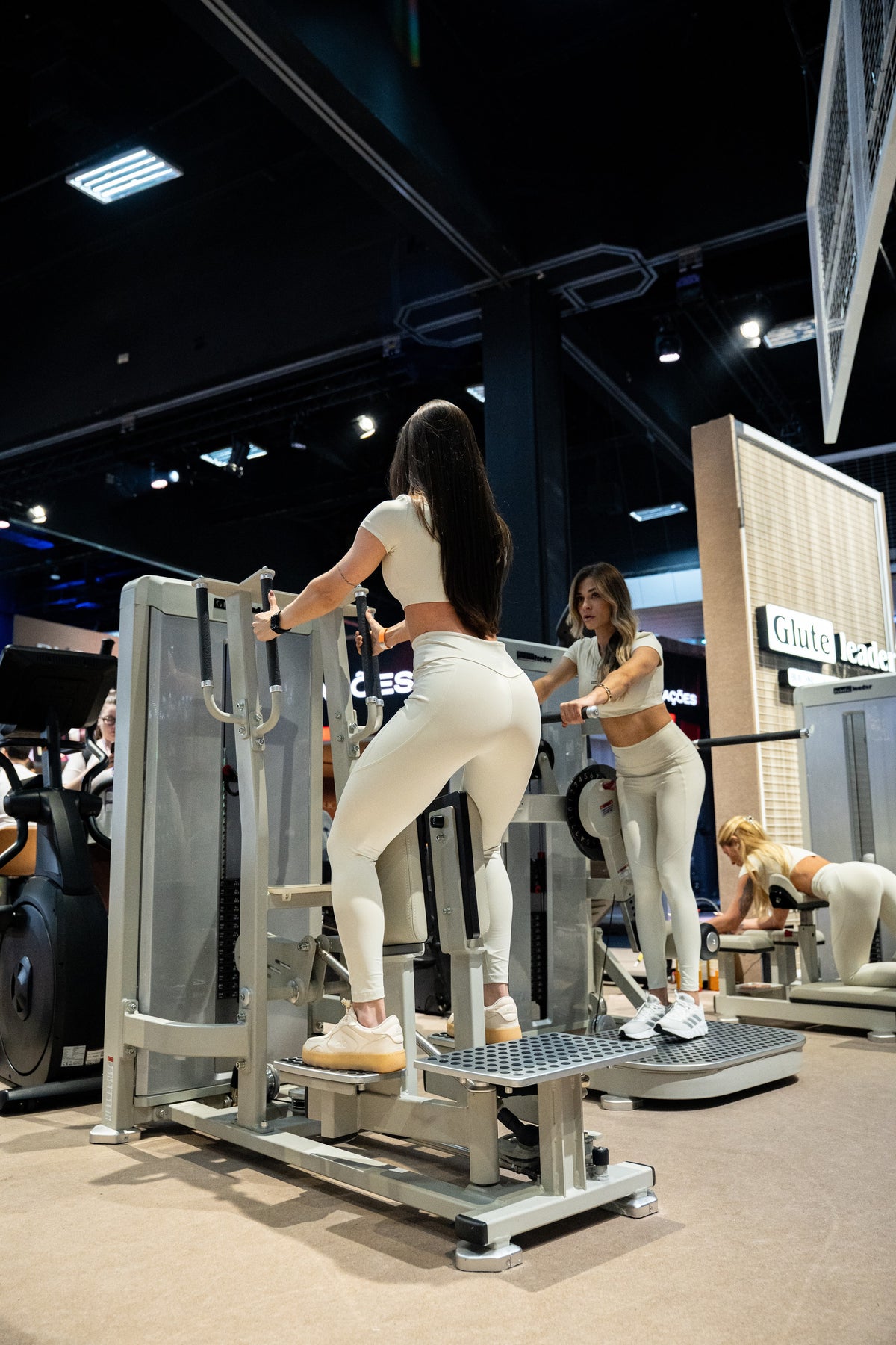 GluteLeader GL-1006 Standing Hip Adductor in use at a fitness exhibition